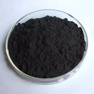 Black powder in a glass dish